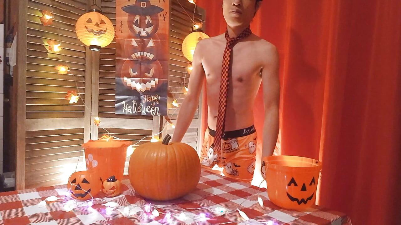 Cute twink Jon Arteen performs a sensual dance while carving a Halloween pumpkin