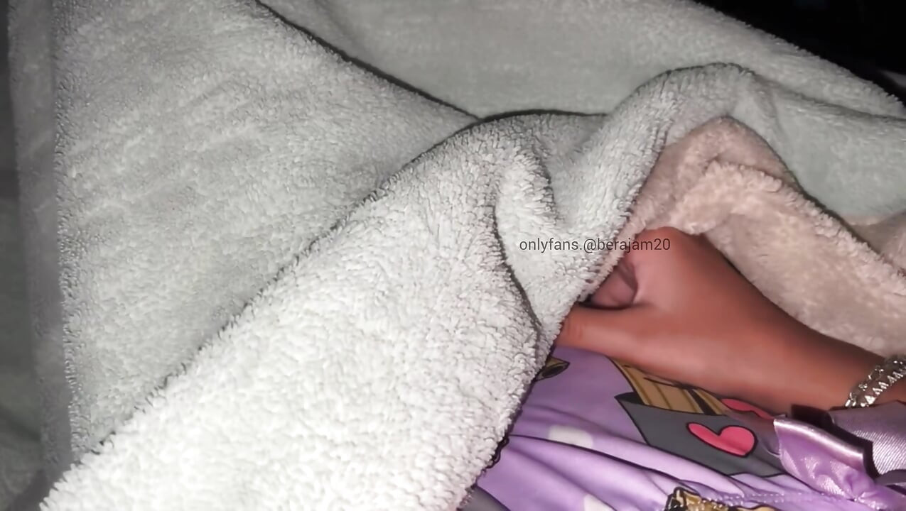 Hot young girl. Under the sheets, she wets her panties with orgasm.