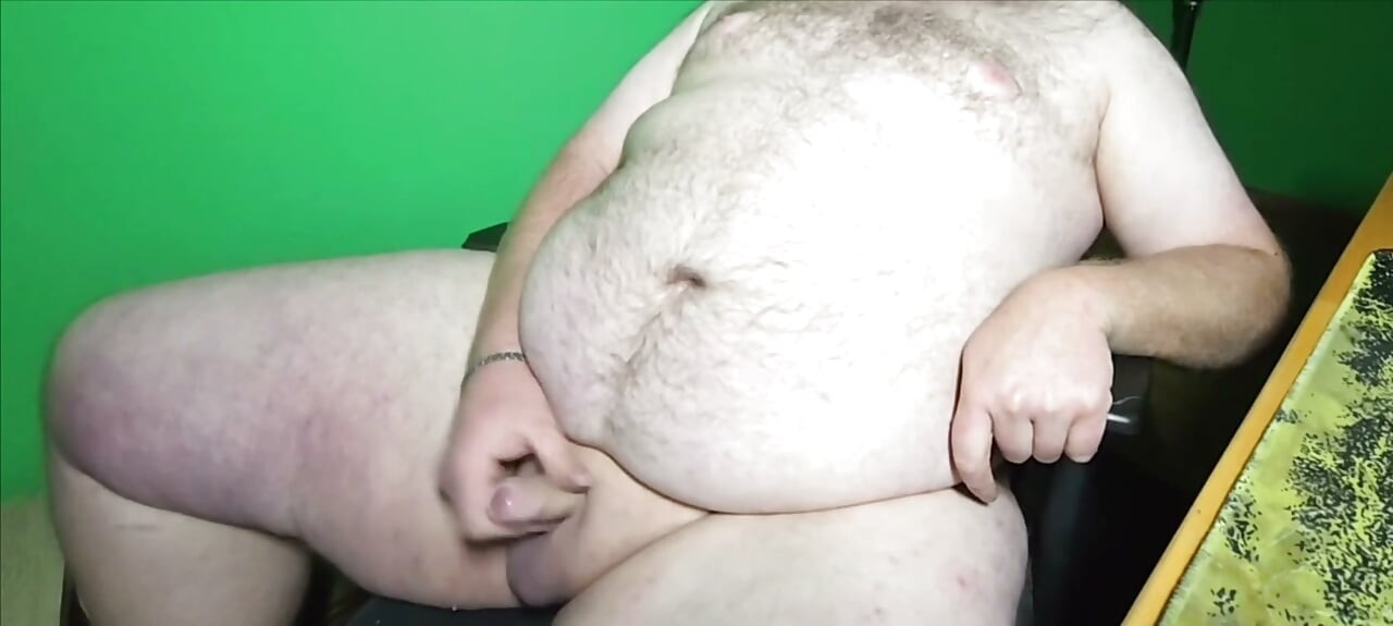 A fat boy with a small dick is masturbating.