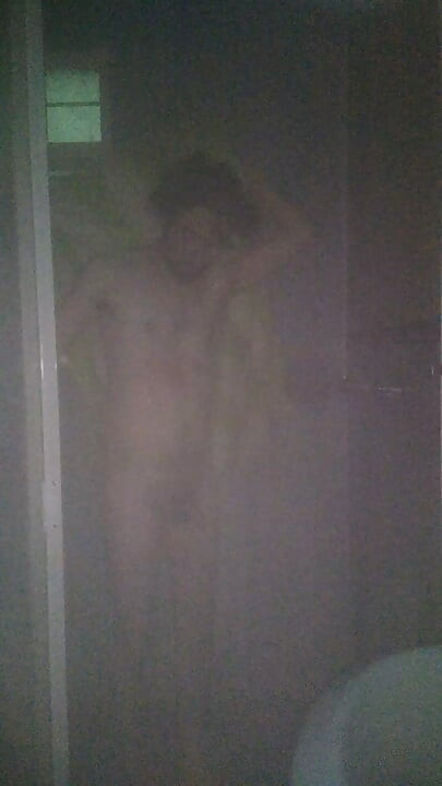 Man Showering with Flashlight On