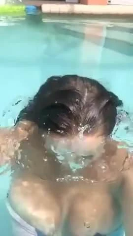 Girl exposes her big tits in the pool