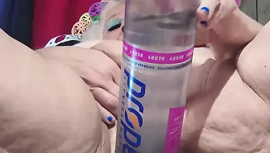 Big Bottle Plugged Clit Cunt