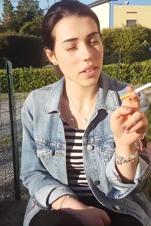 Petra smokes her ciggaretes outdoor