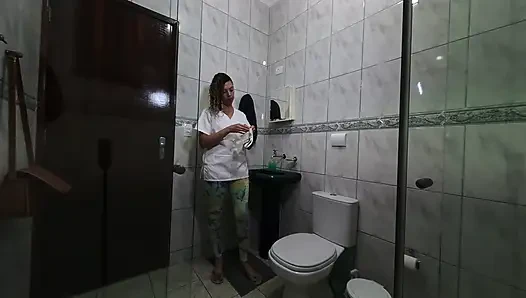 Maid changing clothes in the bathroom.