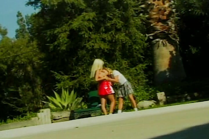Lesbian Babes Sharing Big Dildos Outdoors