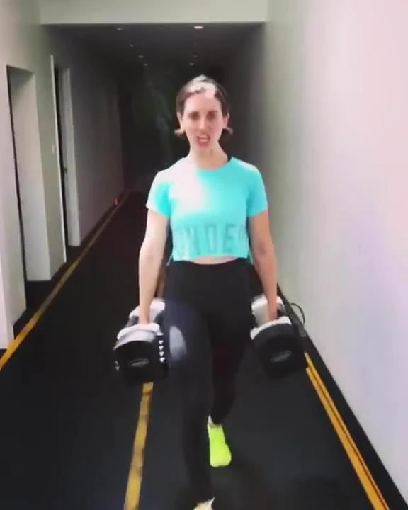 Alison Brie doing a Farmer Walk exercise