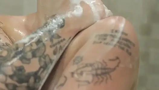 short hair tattooed girl tke a shower and masturbate