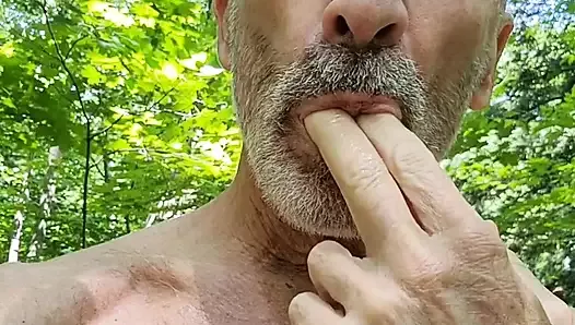 Daddy take a walk in the Wood, stroking his dick, and  have his balls bouncing in the outdoors