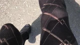 Samantha walking in black OTK socks