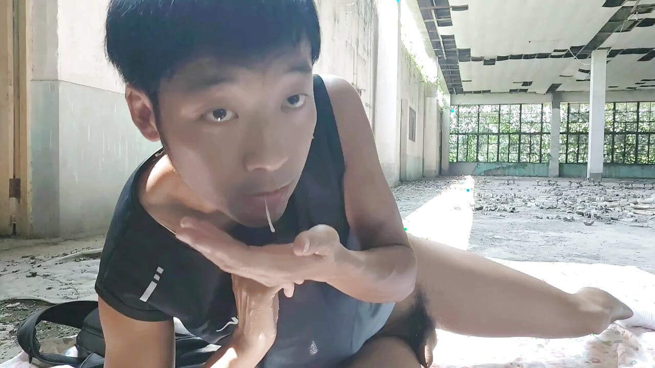 Cute Asian boy masturbates, moaning, ejaculating, and consuming fluids in a dreamlike light and shadow environment