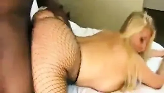 Karen Fisher wearing fishnets gets her shaved pussy pounded.