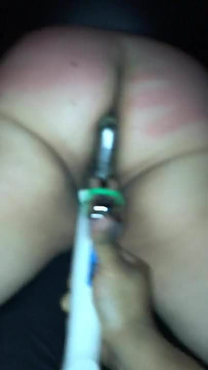 Rubber her clit with the wand while the dildo is fucking her
