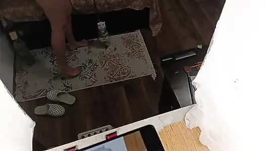 Sexy brunette doing naked chores around the house.