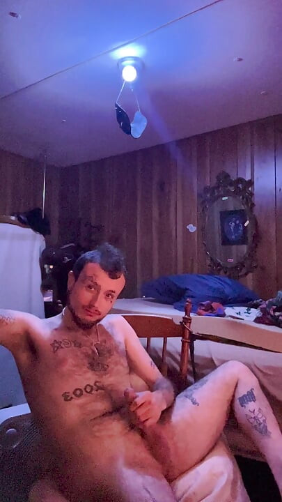 Tattoo stud playing with his cock