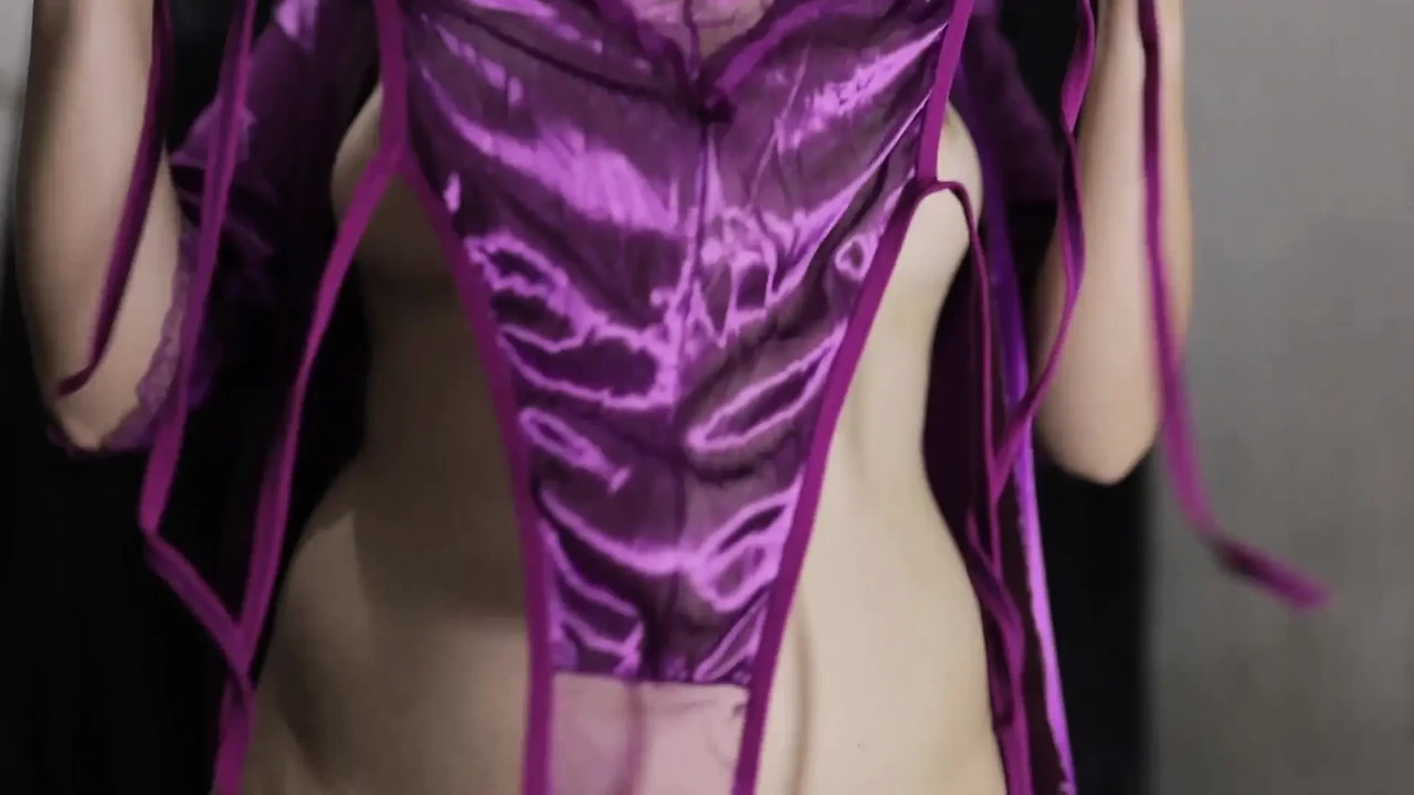 A YOUNG GIRL WEARING A PAIR OF SCARLET LINGERIE AND A PAIR OF SCISSORS