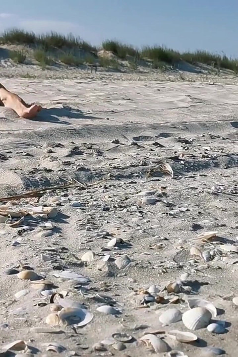 Hot MILF Masturbating on the Nudist Beach Got Caught on Camera