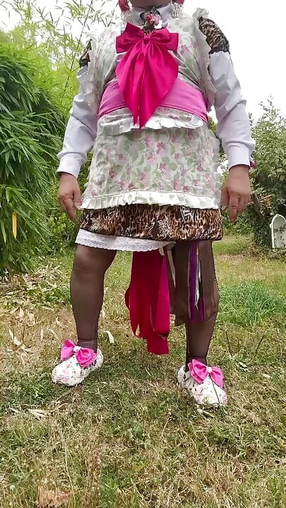 In gardener's outfit with a little leopard dress to pee on all fours