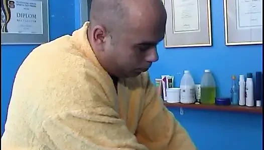 Masseur banging twink on the massage table