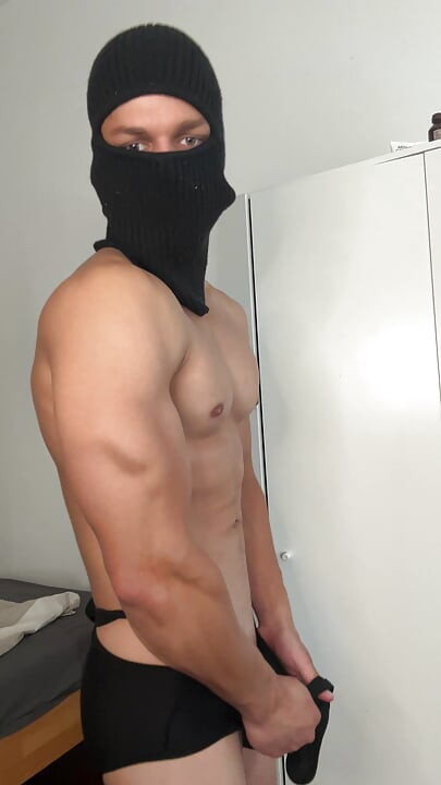 Muscle hunk teasing in a tight singlet