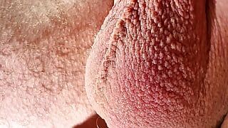 Close-up testicles massaging until big cumshot