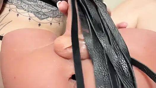 Tattooed BDSM Girl Dominates Dildo With Flogger And Whip