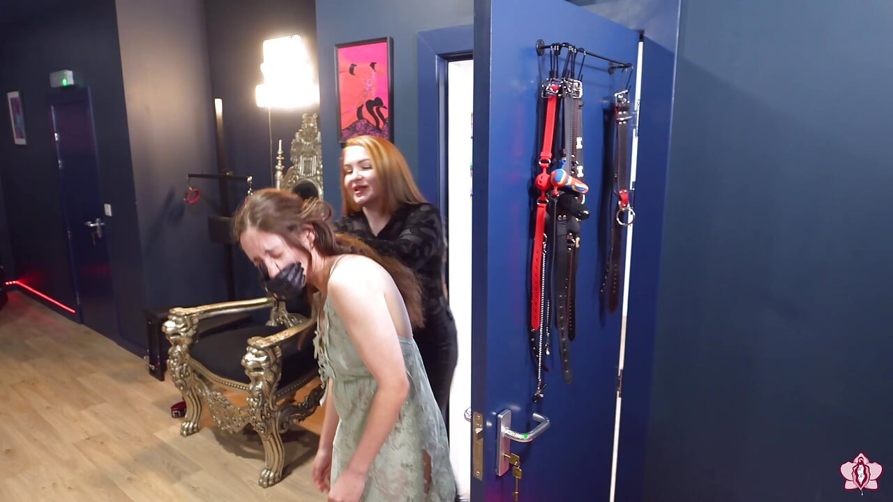 Mistress Elysia Slams Slave Mila Against Wall to Put Hand Over Her Face, Ending in Steamy Lesbian BDSM Kiss
