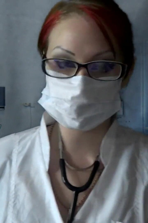 Doctor eating in medical mask and gloves