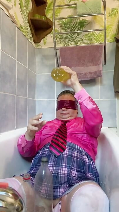 In a schoolgirl outfit to take a piss shower with bottles