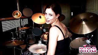 Lesbian Nina with drums showing her perfect body