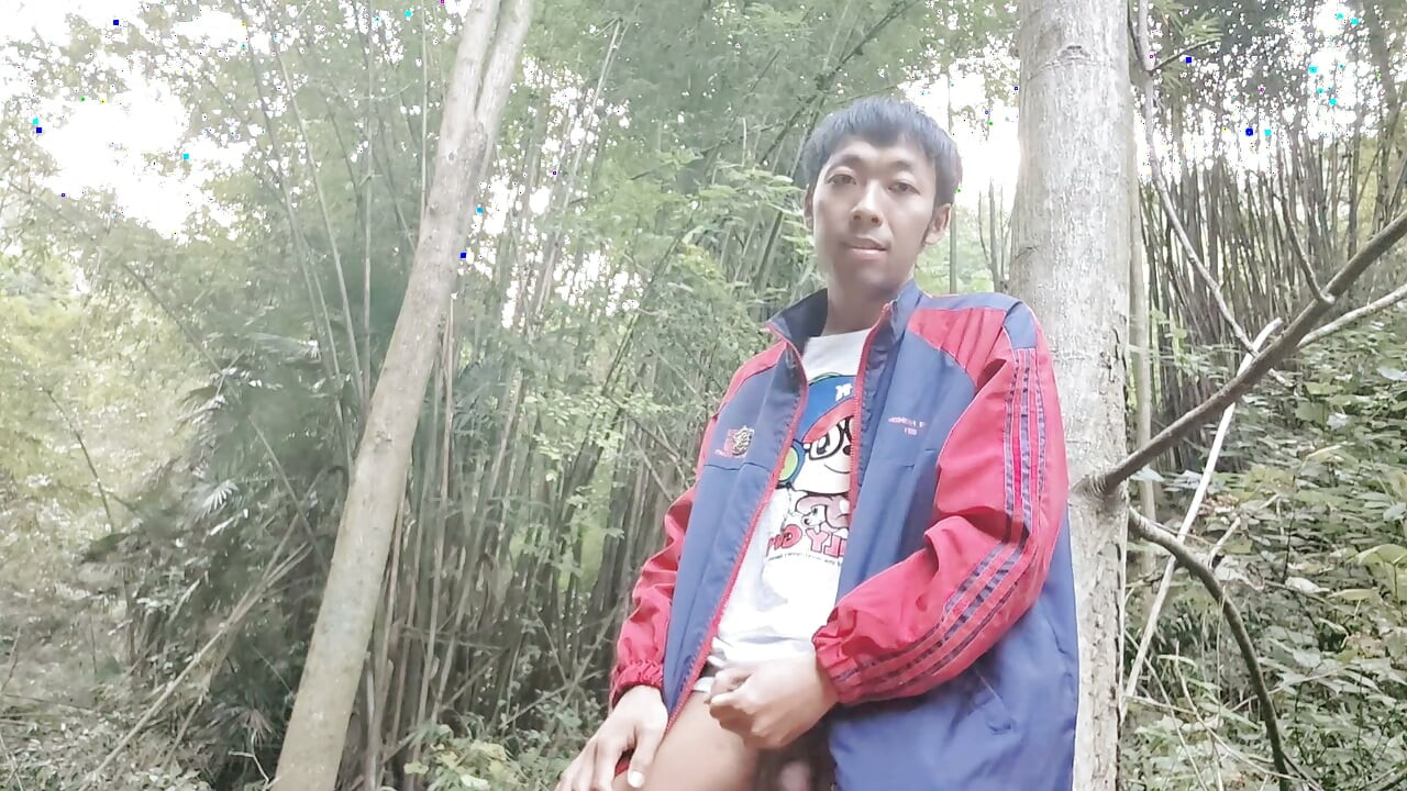 Asian male masturbates in the deep mountains and jungles, moaning and ejaculating, swallowing the liquid
