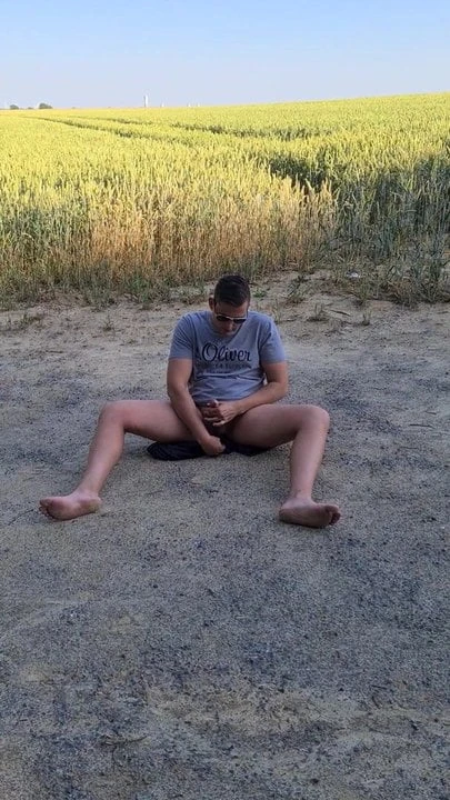 German young twink jerks off outside