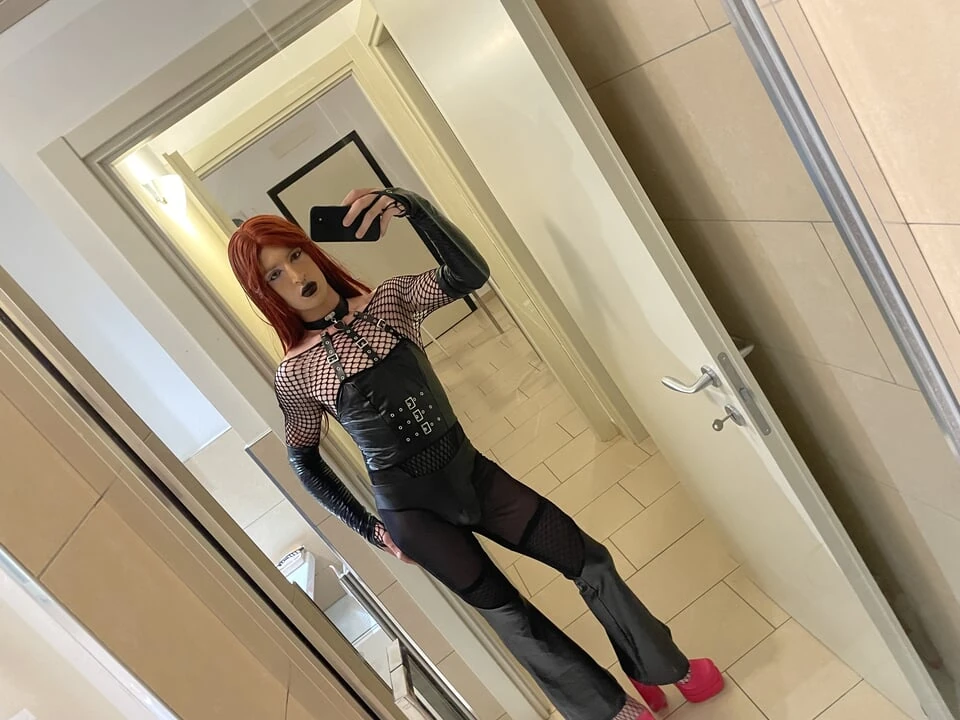 Gothic sissy in chastity anally trains with her dildo, accompanied by valga and handcuffs