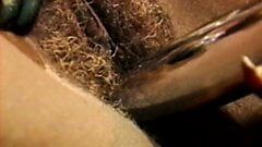 Ebony babe shoves a huge dildo in blonde MILF's cunt