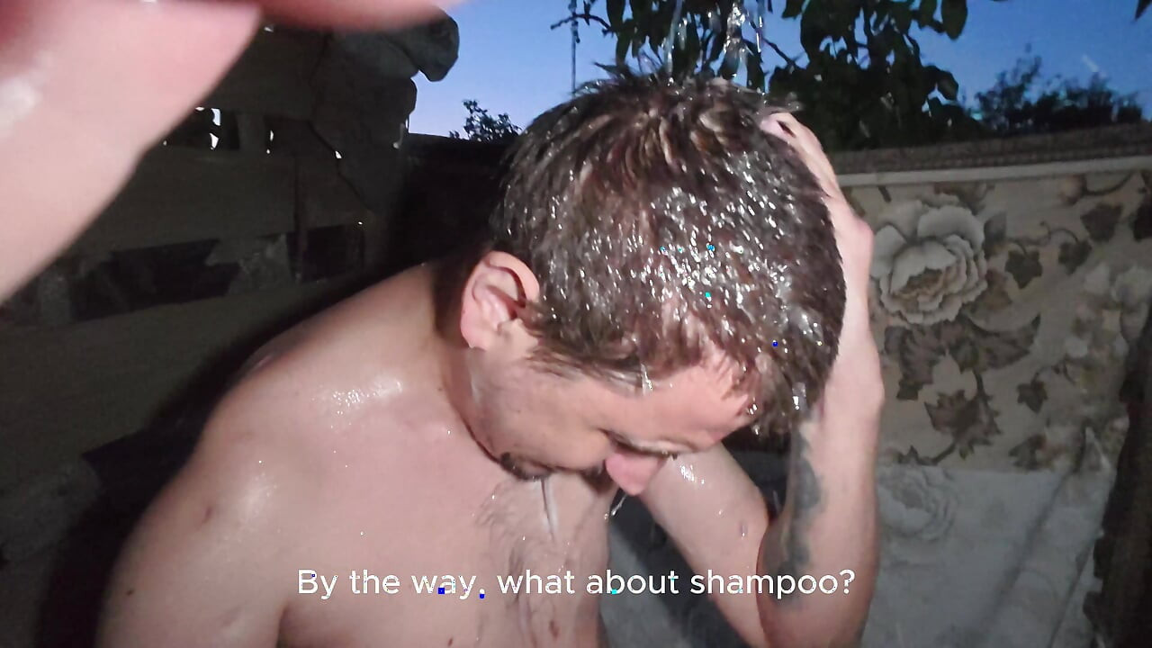 Soapy naked bodies in a rural shower