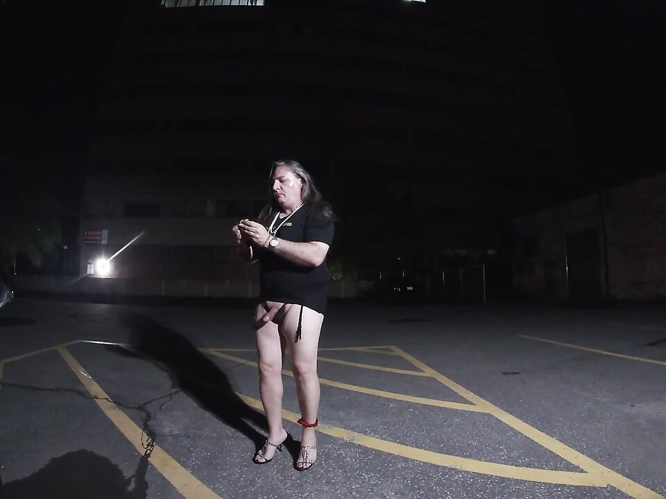 Solo feminized Mature CD goes for a walk in a parking lot