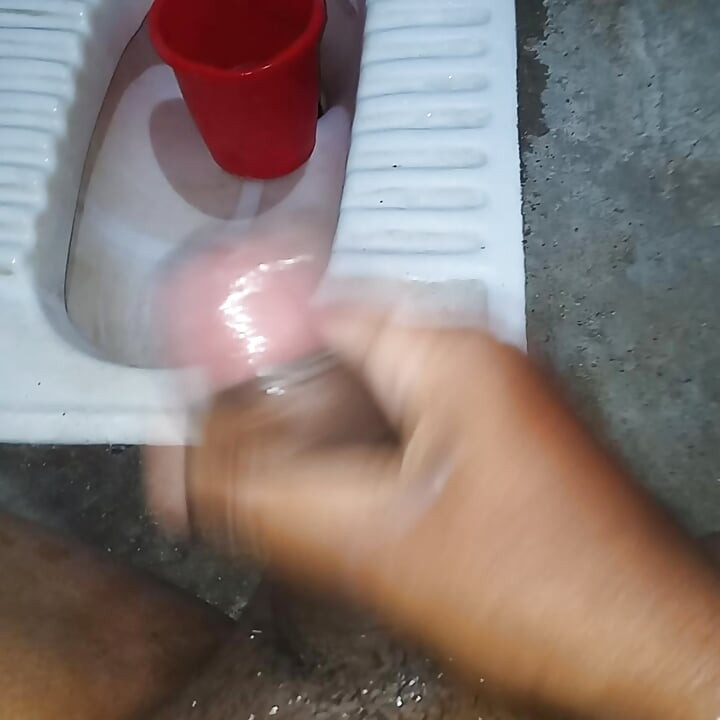 The desi boy went to the bathroom and punched him and took out the