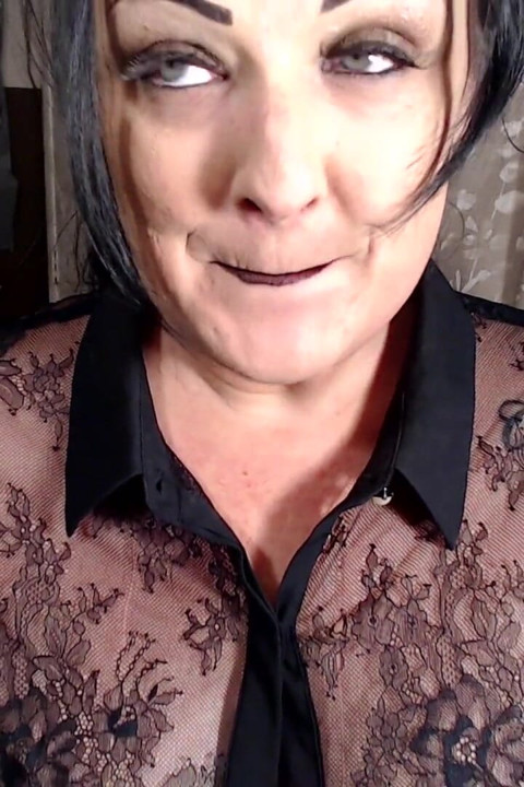 Milf putting on dark red lipstick