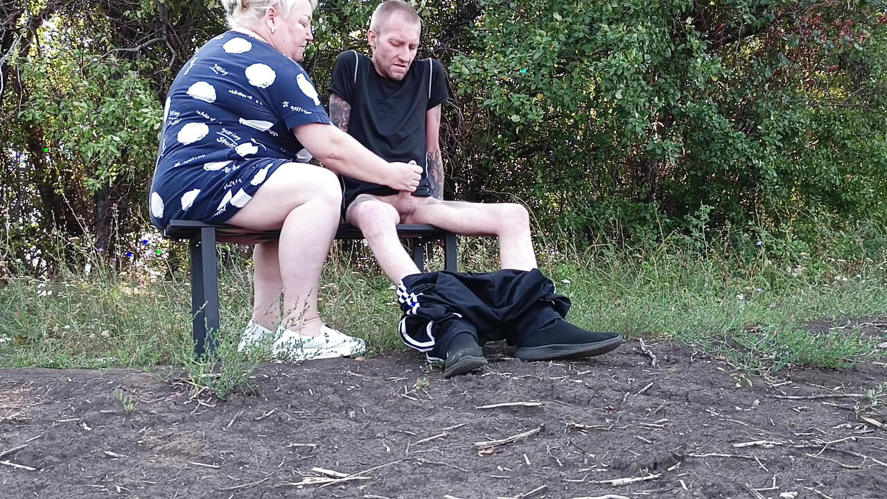 A neighbor in a public park jerks off my dick until I cum
