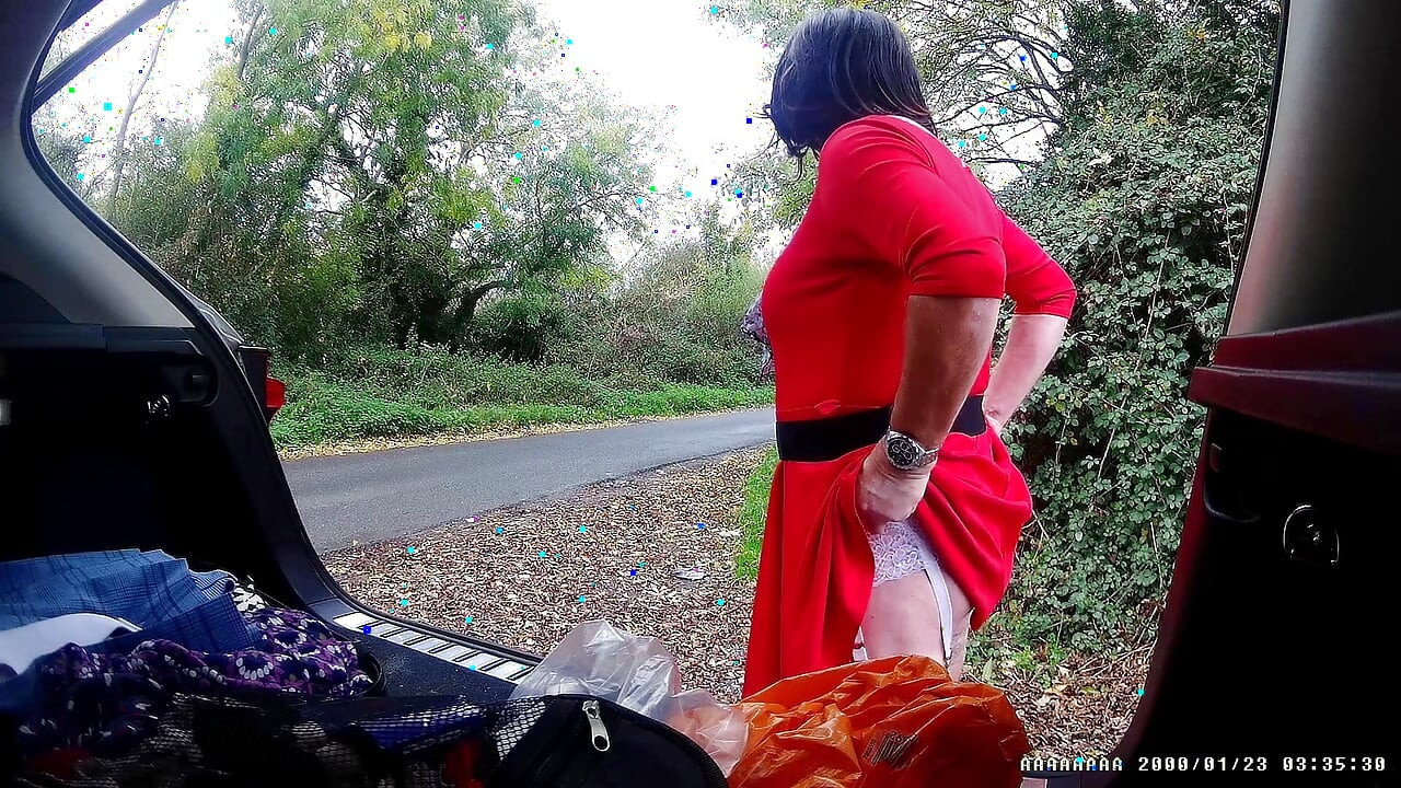 Just getting changed parked at side of road with cars driving past