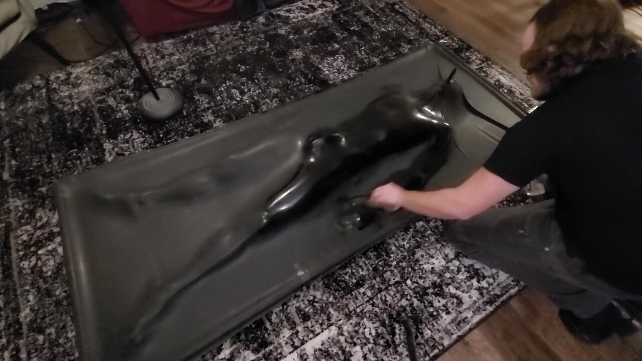 Cute twink tormented in latex vacbed