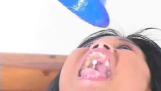 Horny Asian chick in pink fucks two dicks and eats cumload