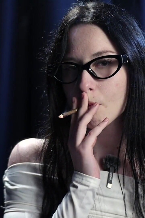 Smoking Seduction - Intriguing Lady in White. 2 Black Cigarette in a Row.