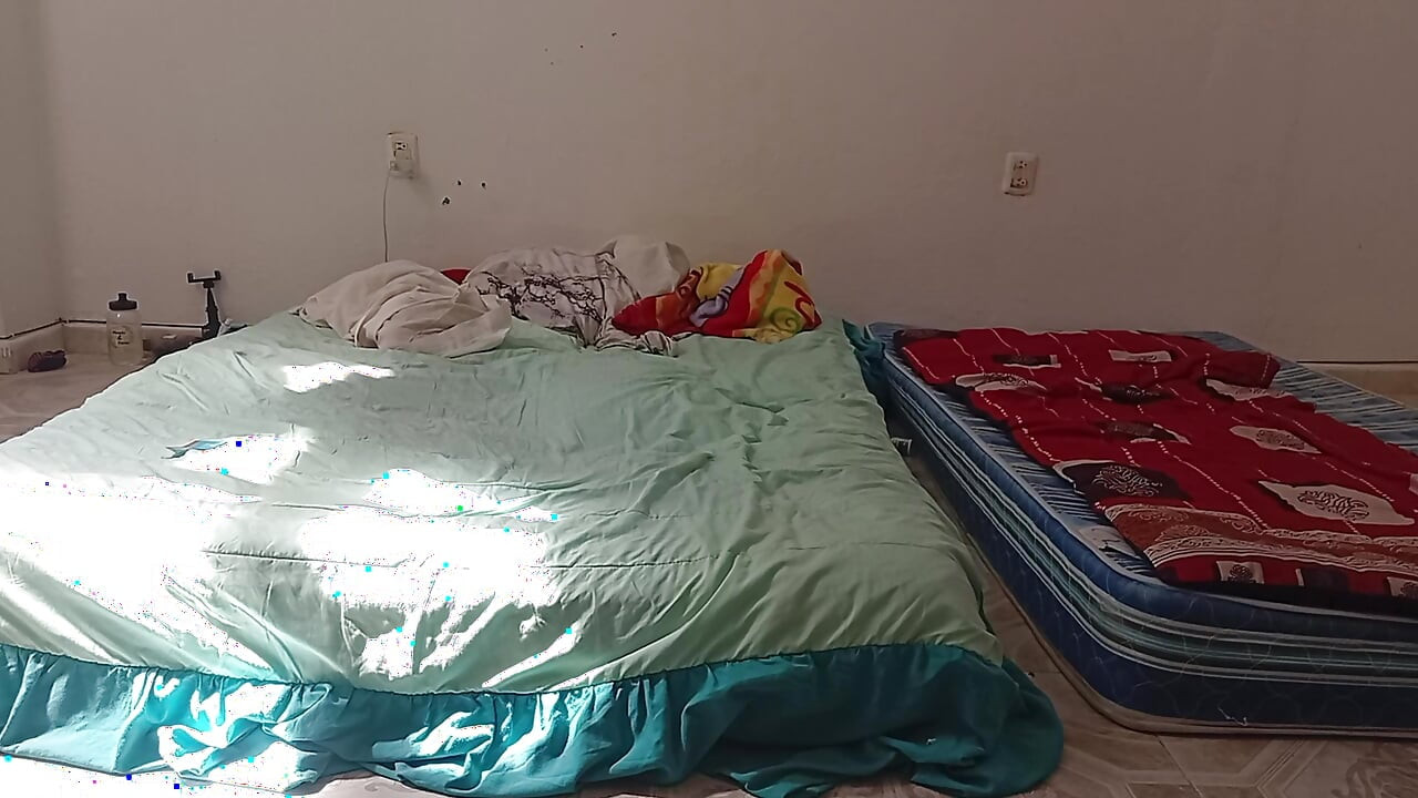 Mexican mother-in-law cleaning guest room in thong