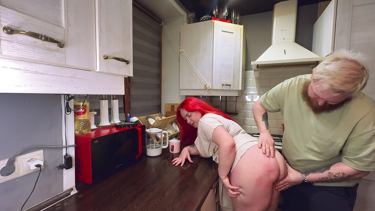 Sex in the kitchen with a red-haired wife. .