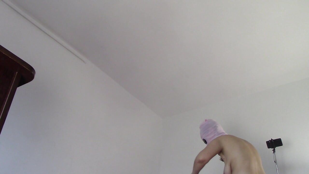Amateur wife dancing naked at home. Amateur woman has fun trying on clothes and cutting them.