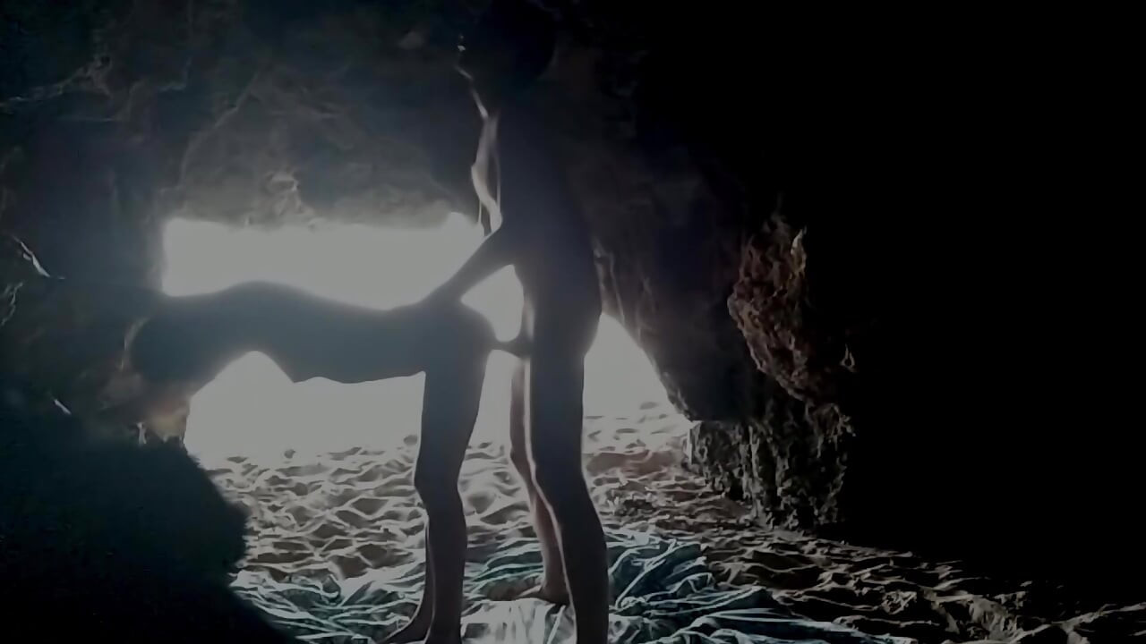 Couple recorded at the beach, inside the cave