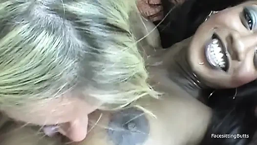 A blonde and a black milf are engaging in mutual licking before to engag...