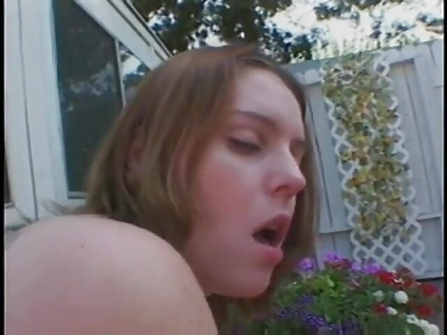 Lusty teen rides a big pecker in the middle of a garden