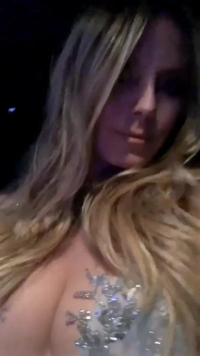 Heidi Klum in a sexy dress with massive cleavage