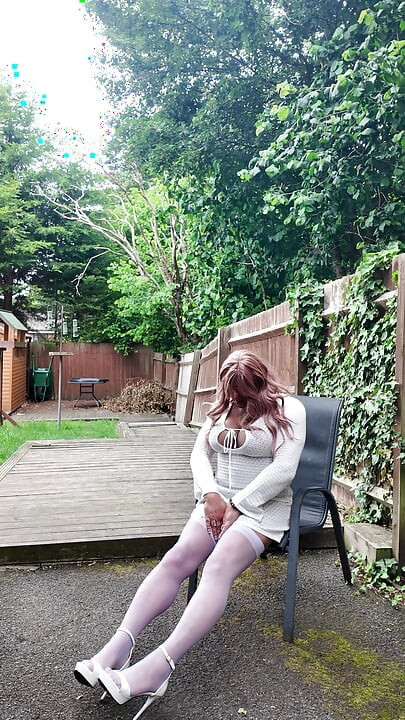 Crossdresser kellycd in white dress stockings and heels
